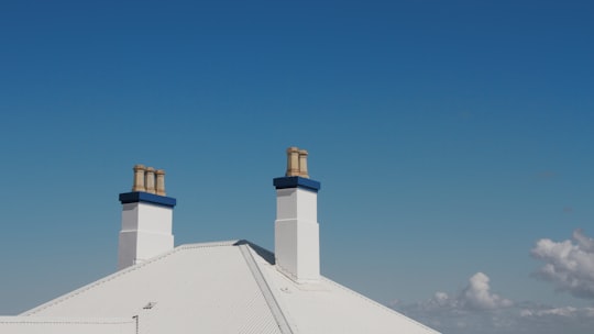 white concrete building under blue sky during daytime in Forster NSW Australia