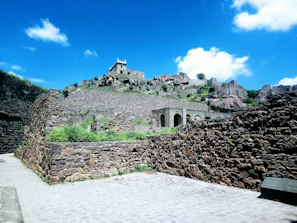 A historical fort standing majestically against a clear blue sky.