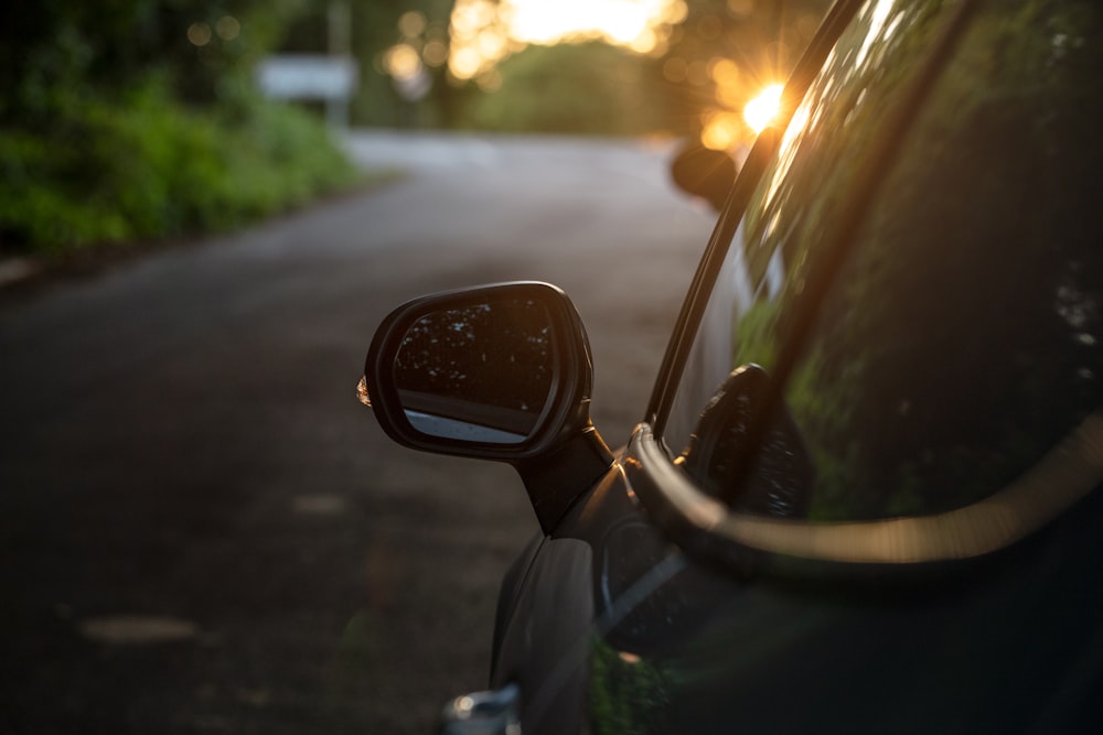 car side mirror with water droplets