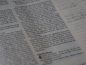 A close-up of a student’s notebook filled with Quranic notes and translations.
