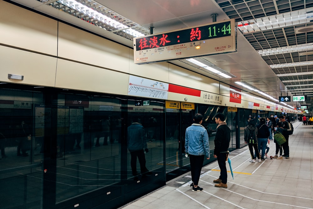 people walking on white floor tiles