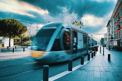 white and yellow train on rail road during daytime nice google meet background