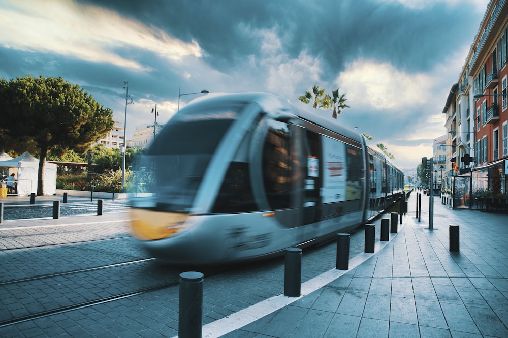 white and yellow train on rail road during daytime