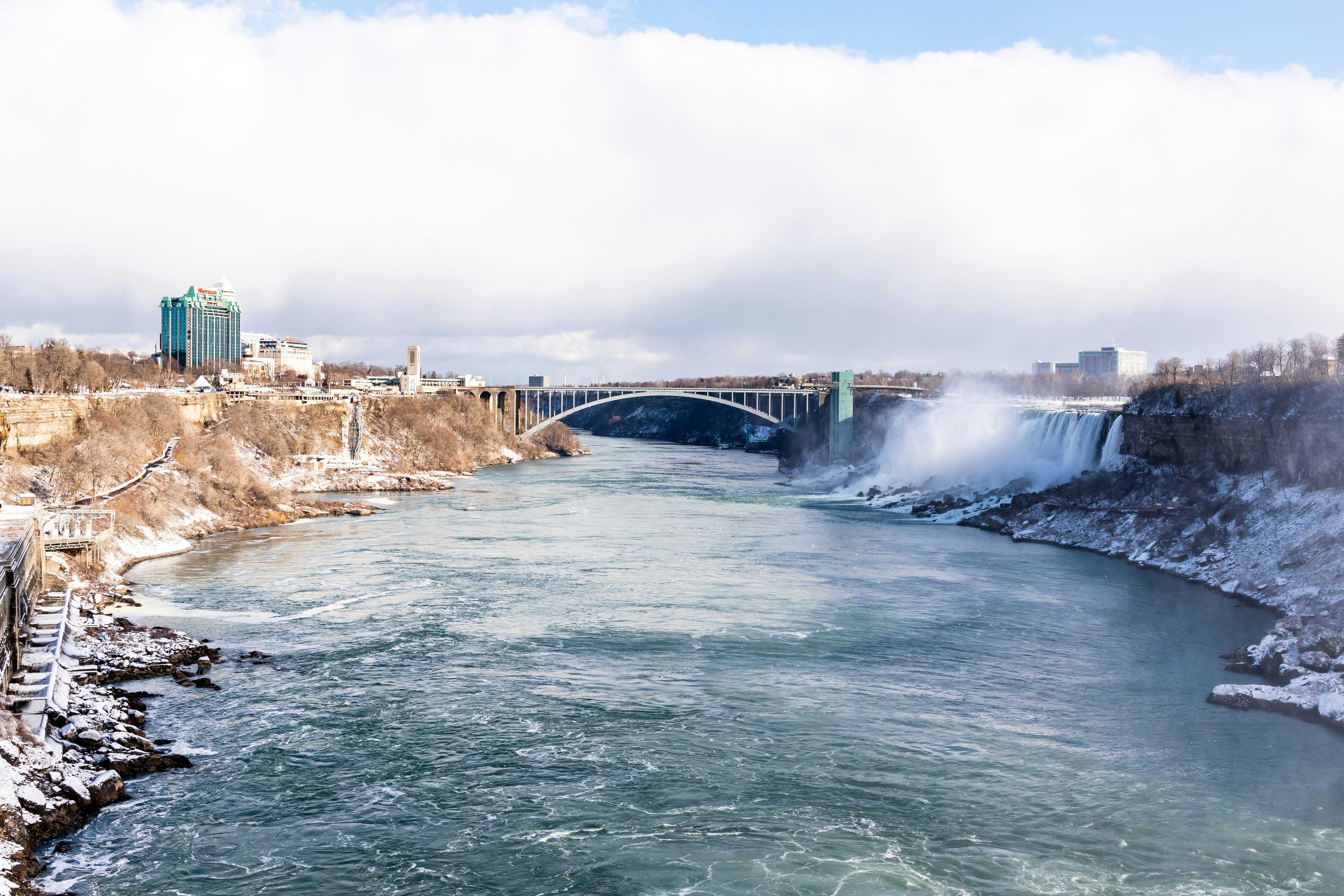 water falls under white sky during daytime, 