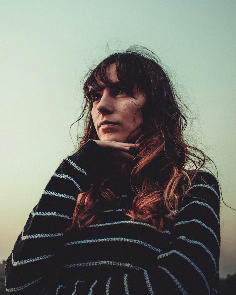 woman in black and white striped sweater