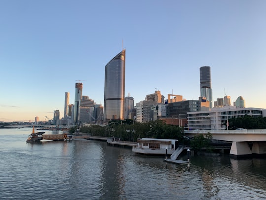 white boat on water near city buildings during daytime in Goodwill Bridge Australia