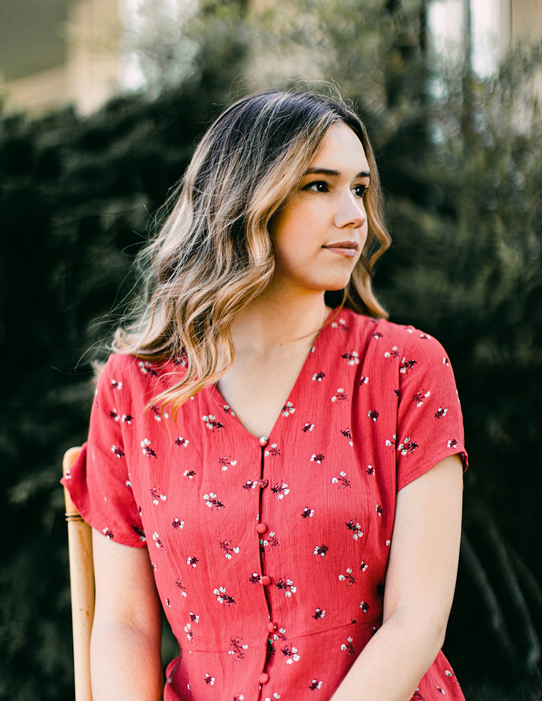 woman in red and white polka dot shirt