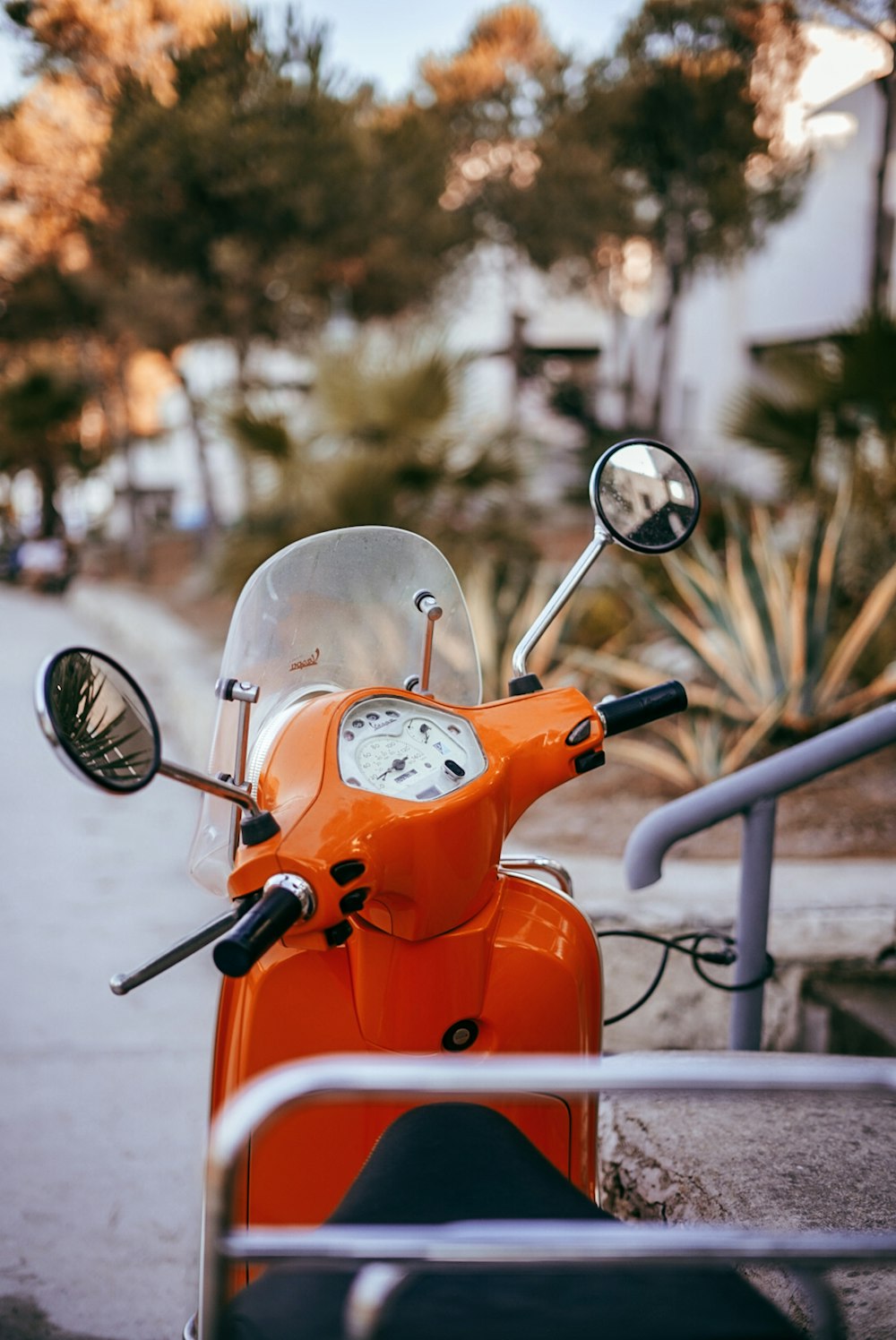 orange and white motor scooter