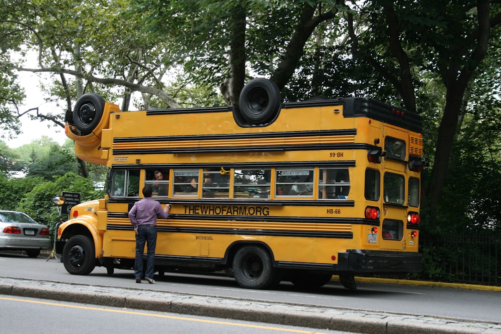 yellow school bus on road during daytime