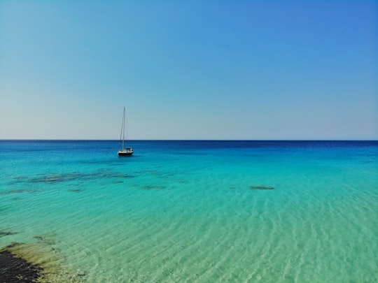 boat on sea during daytime in Kedrodasos Beach Greece