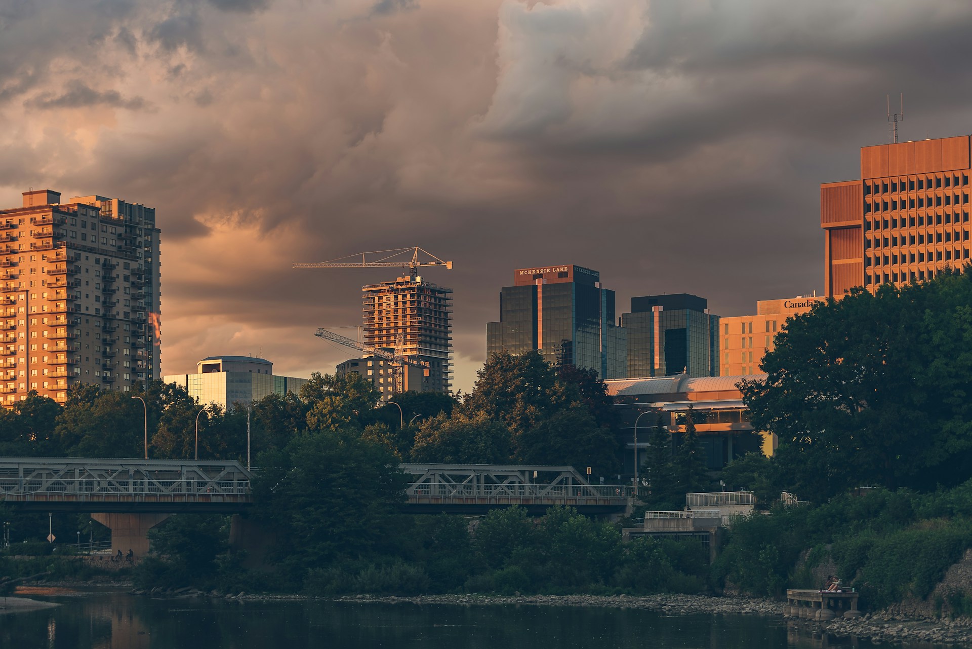 city skyline under cloudy sky during daytime