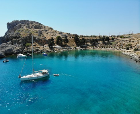 White and blue boat on water during daytime — Rhodes, Greece