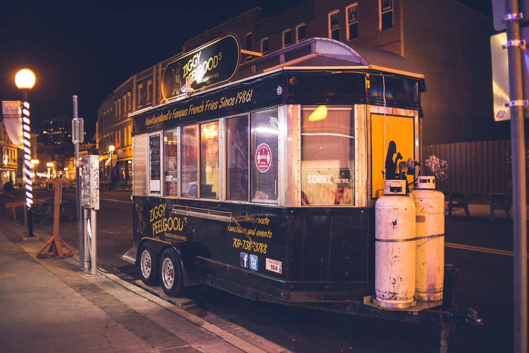 black and yellow bus on road during night time