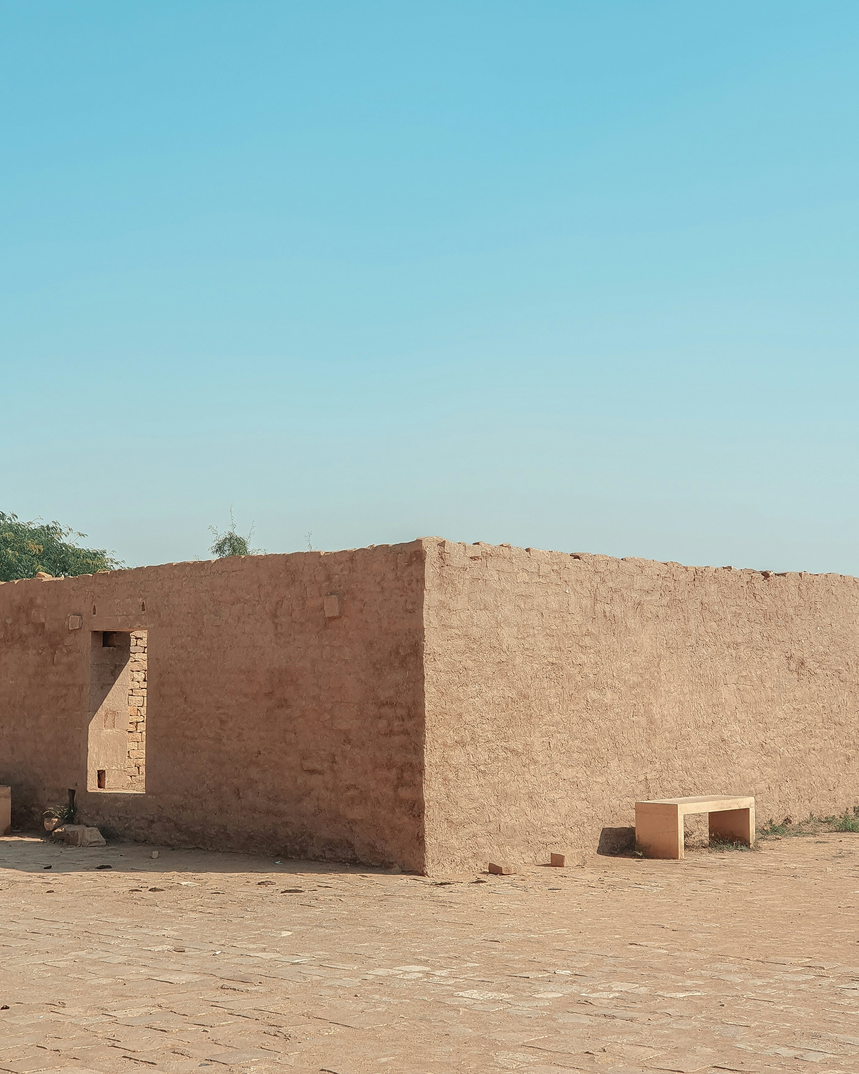 brown concrete building under blue sky during daytime