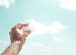 person holding white cotton candy