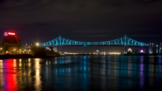 bridge over water during night time in Parc de Dieppe (renamed recently) Canada