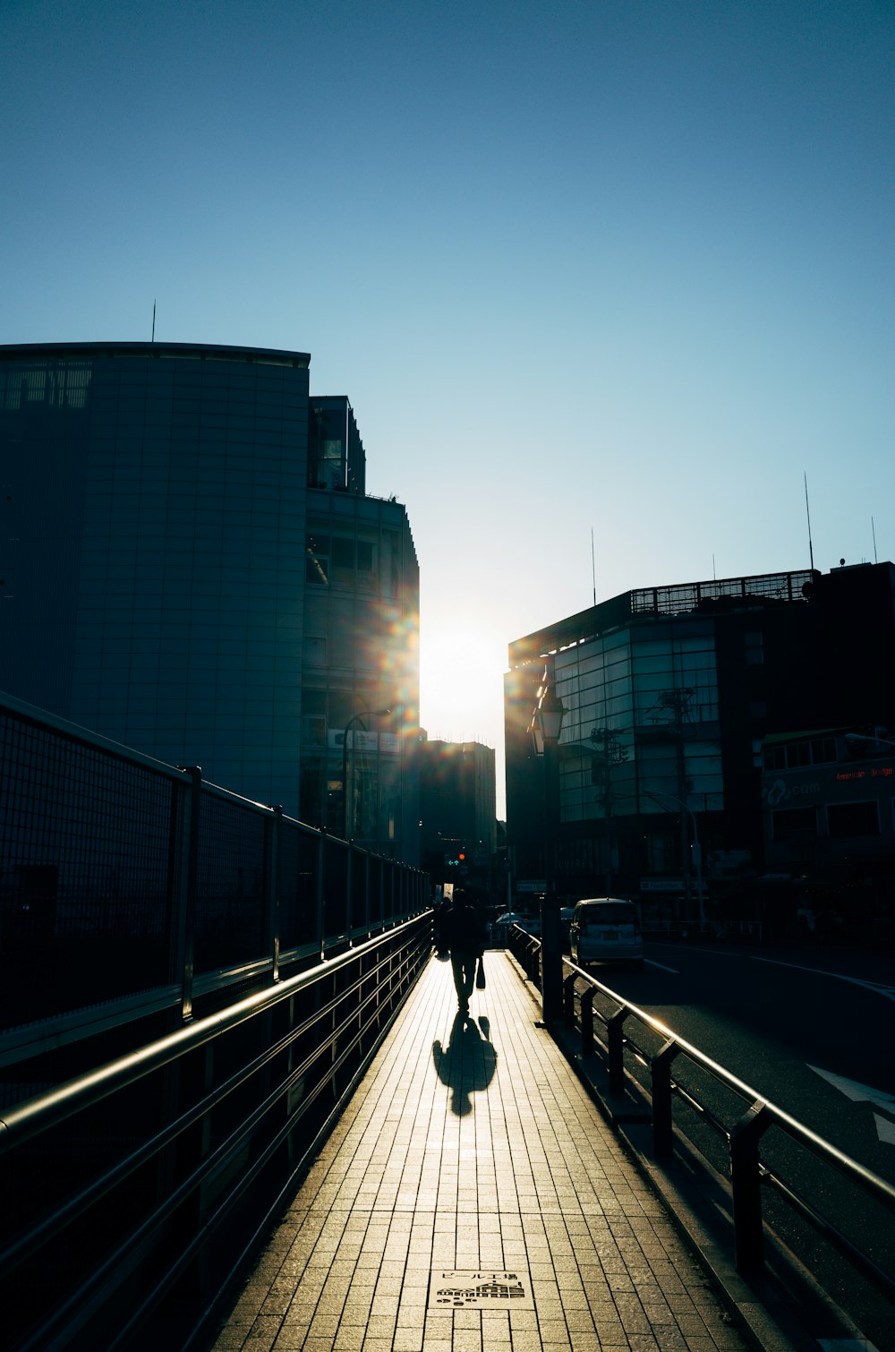 people walking on sidewalk near high rise buildings during daytime