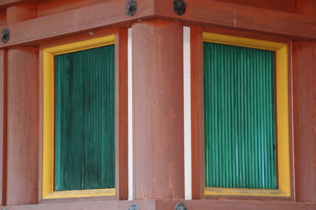 brown wooden framed green window