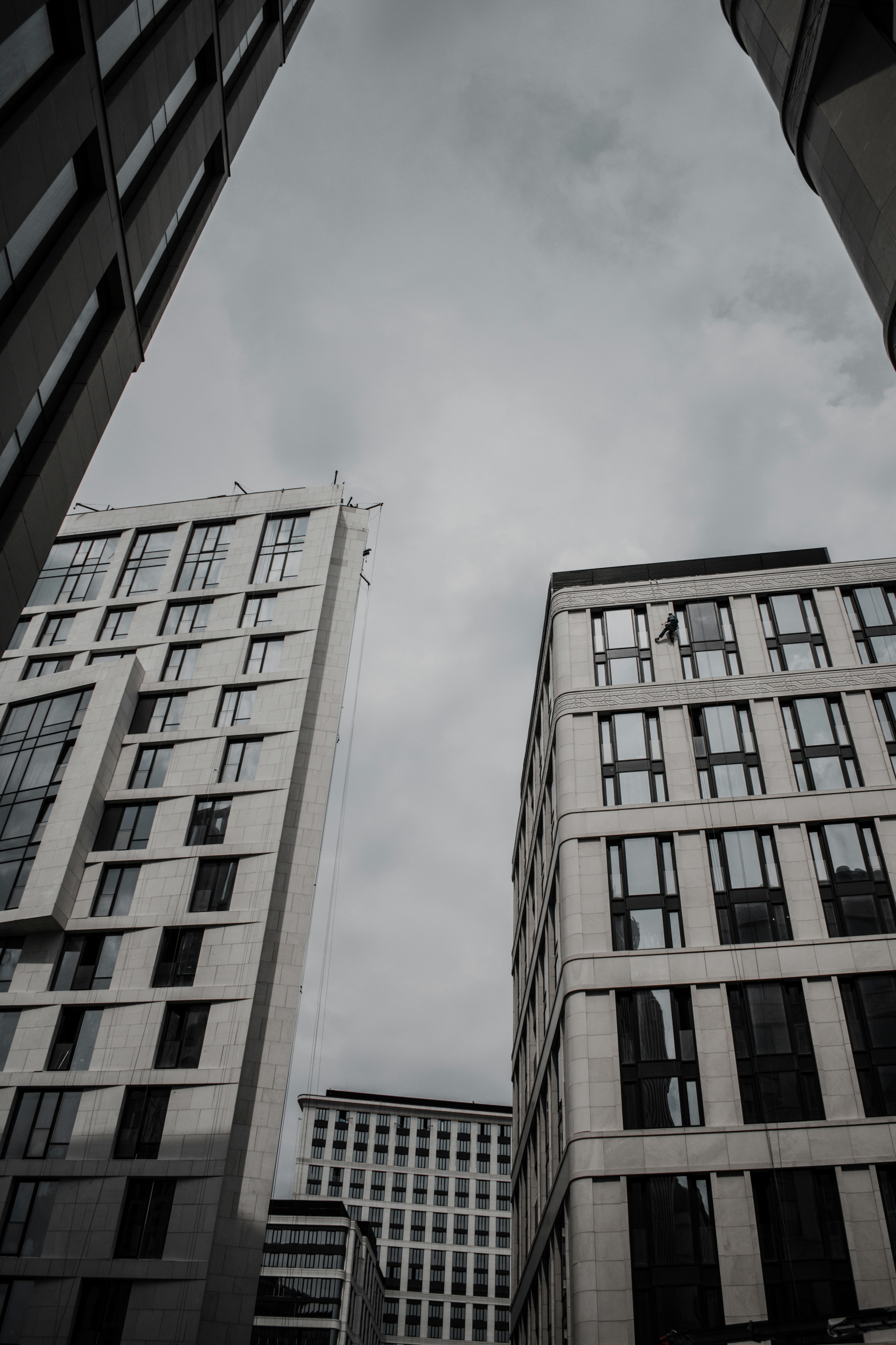 brown concrete building under white clouds during daytime