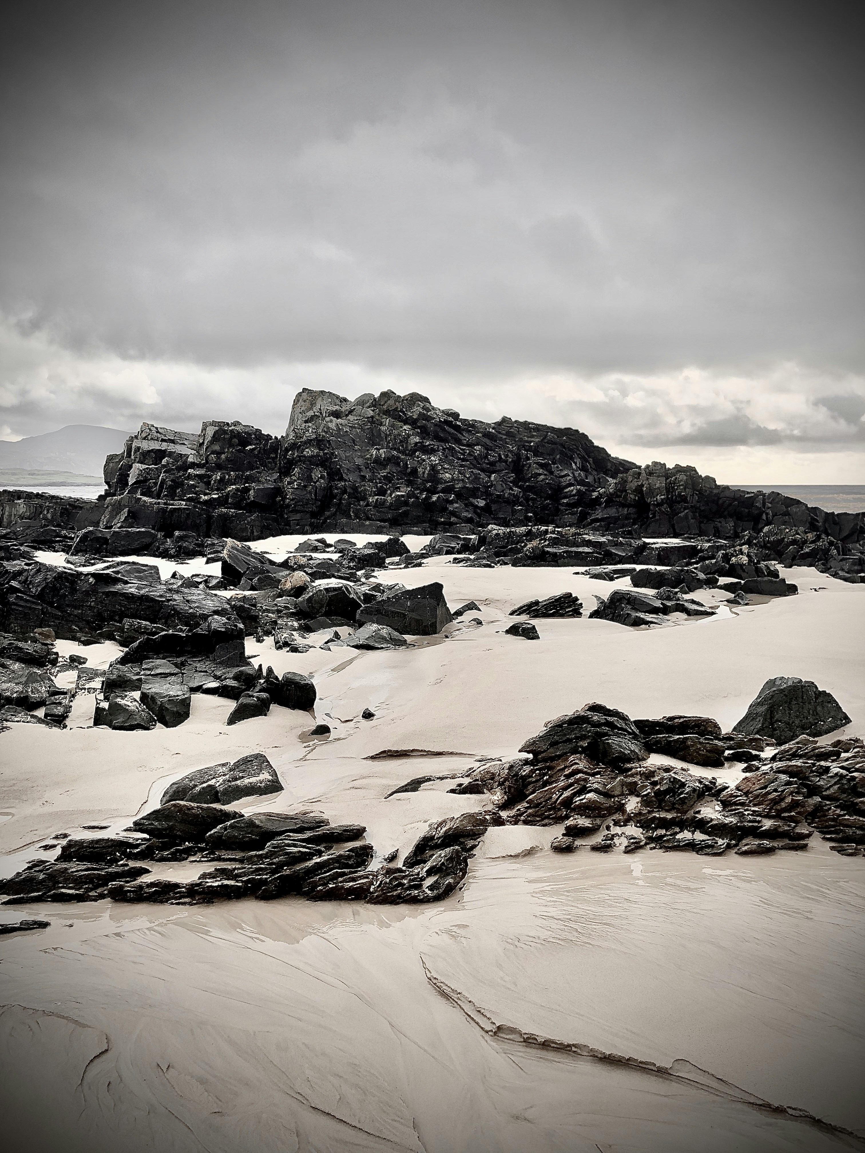 gray rocky mountain under gray sky