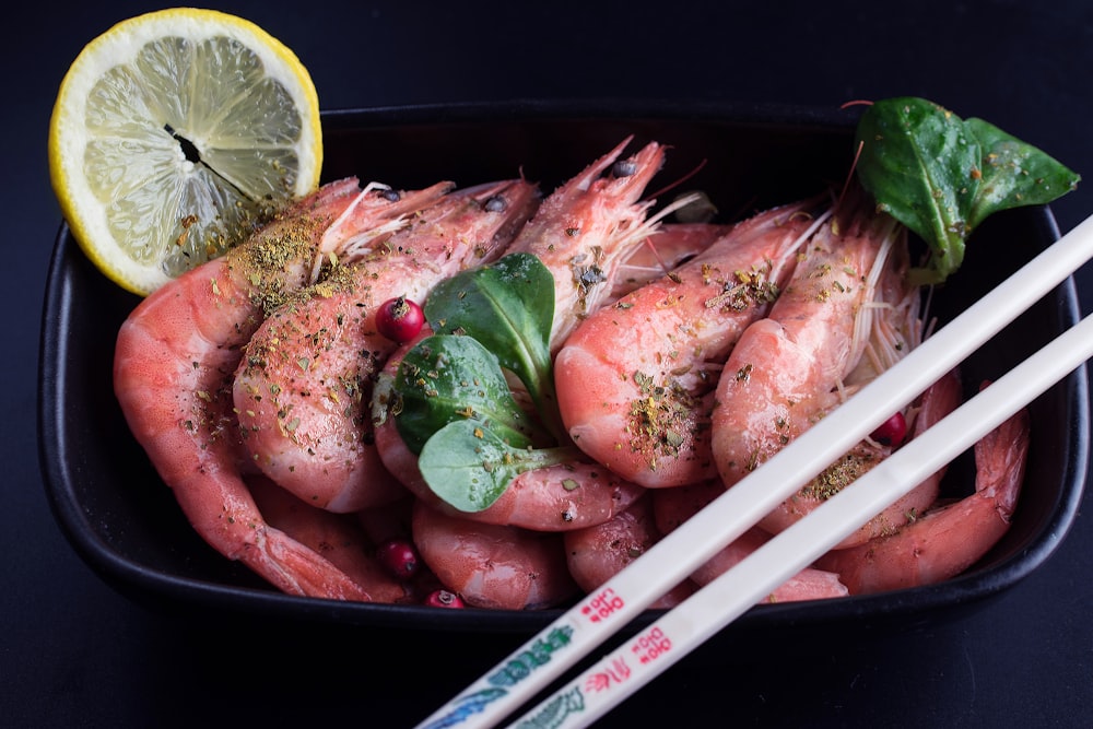 raw fish on black container