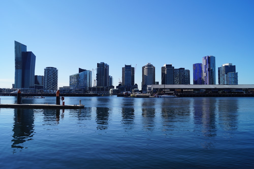 city skyline across body of water during daytime