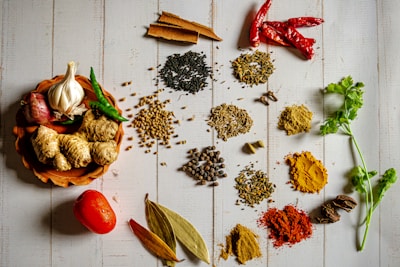 a variety of spices on a white table