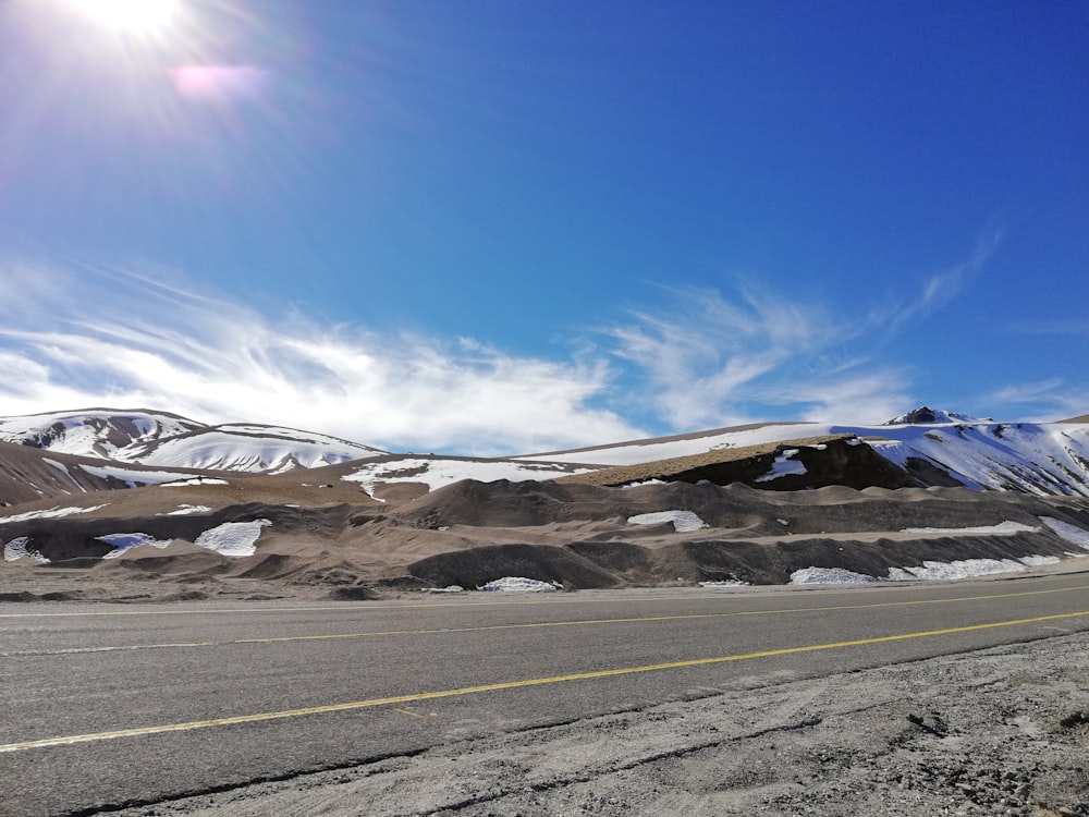 brown and white mountains under blue sky during daytime