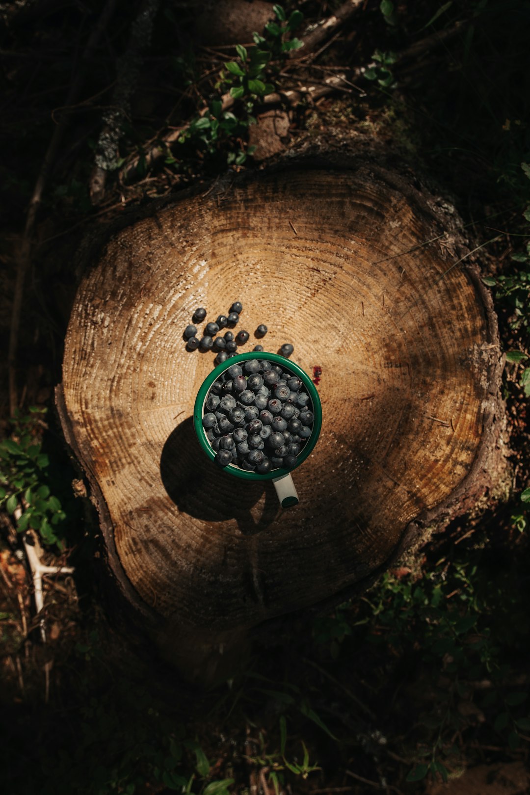 black and green beads on brown wooden round table