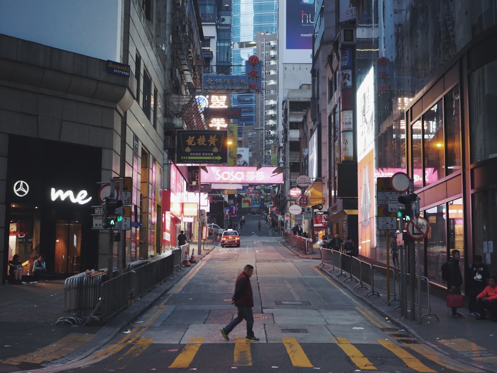 people walking on street during night time