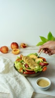 Hands preparing a nutritious salad with various fresh ingredients.