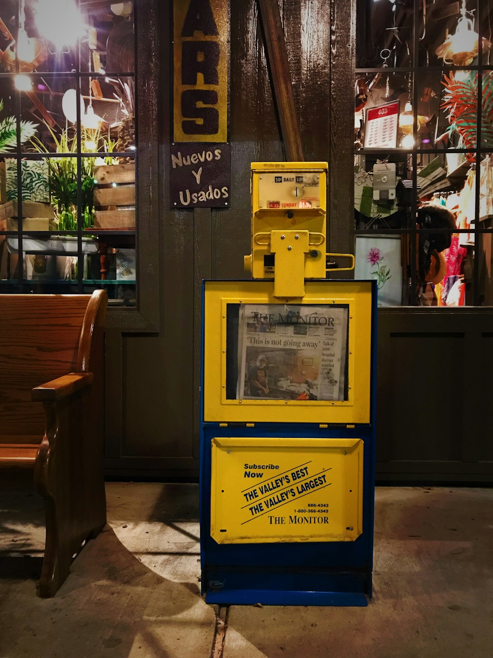 yellow and black telephone booth