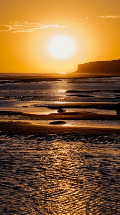 A stunning sunset over a beach in Portugal.
