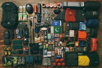 A collection of outdoor gear including backpacks and tents.