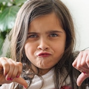 girl with thumbs down disappointment look