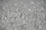 Team members wrapping delicate items with bubble wrap, showing attention to detail.