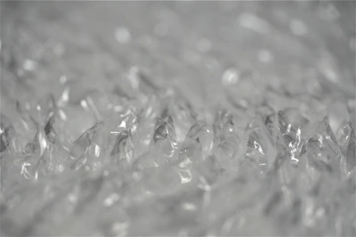 Team members wrapping delicate items with bubble wrap, showing attention to detail.