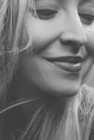 A smiling professional after a session, showing visible relief and calm.