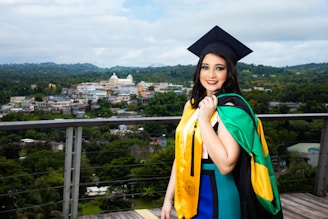 An international student happily holding a scholarship award letter with university flags behind.