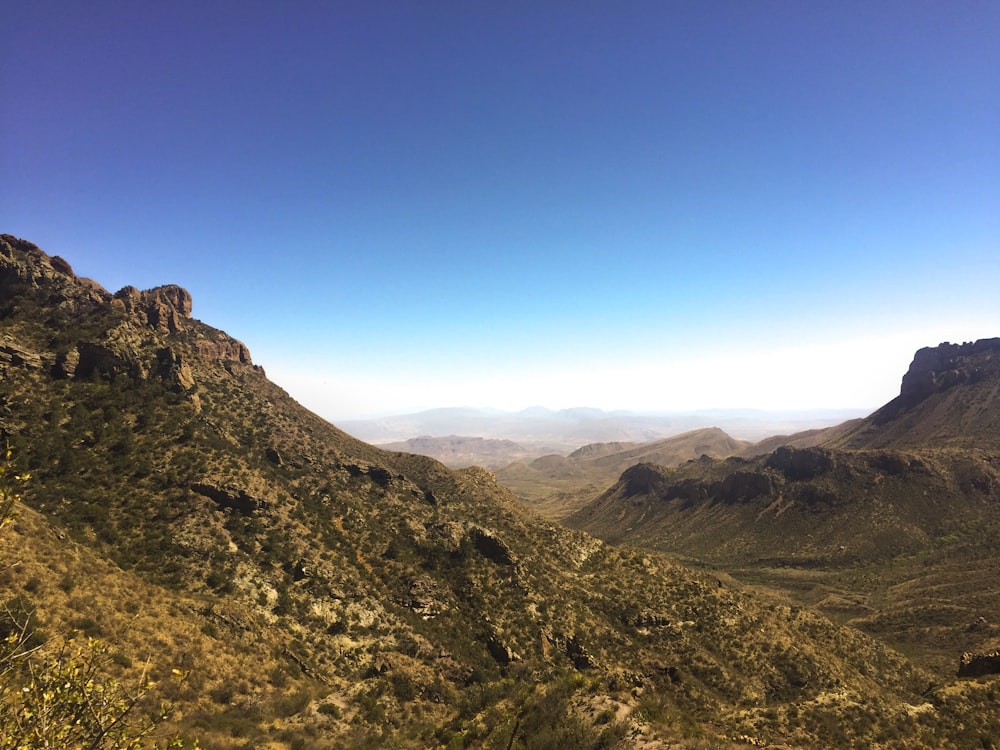 green and brown mountain under blue sky during daytime