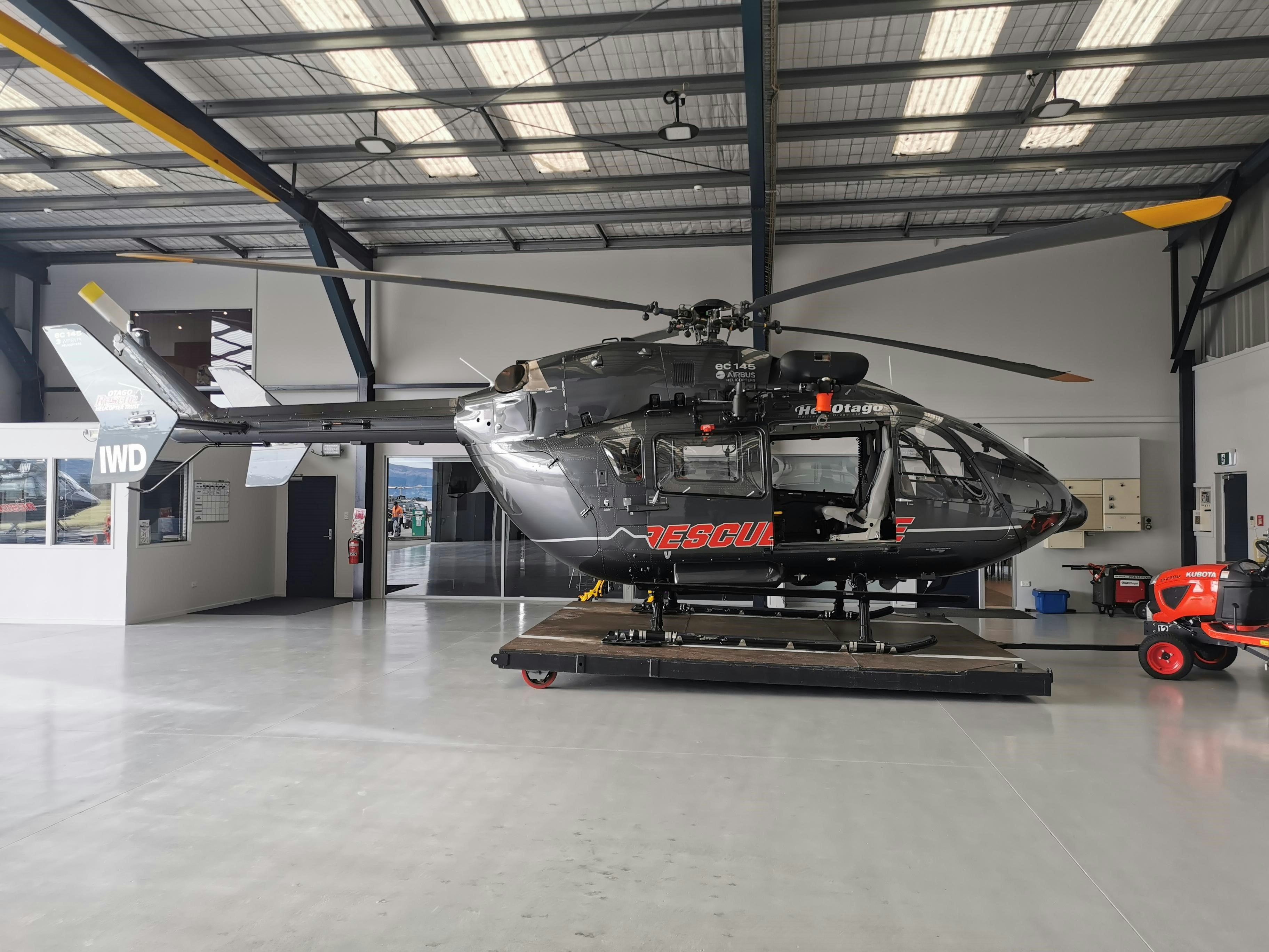 white and black helicopter in a room, 