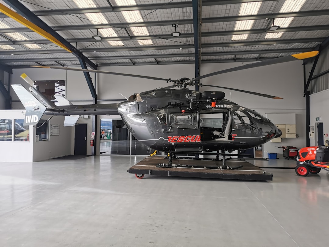 white and black helicopter in a room,
