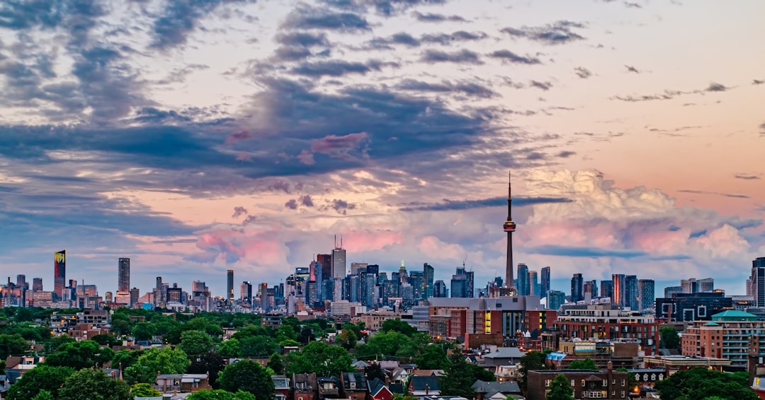 city skyline under cloudy sky during daytime