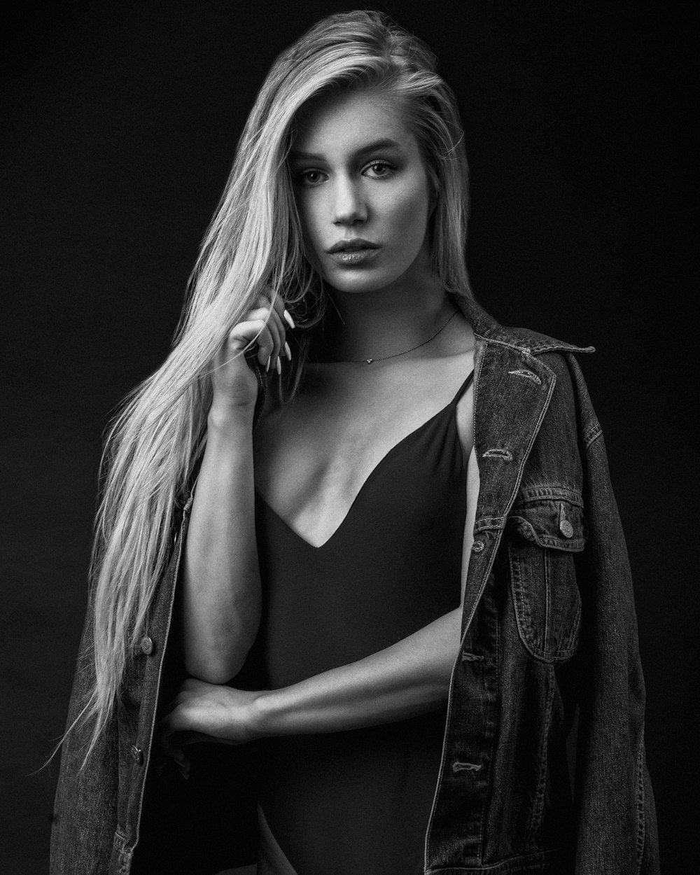 woman in black tank top and black jacket