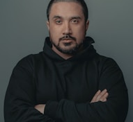 man in black hoodie standing