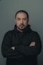 man in black hoodie standing