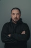 man in black hoodie standing