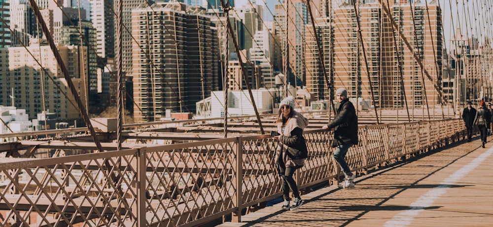 people walking on bridge during daytime