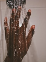 persons hand with silver ring