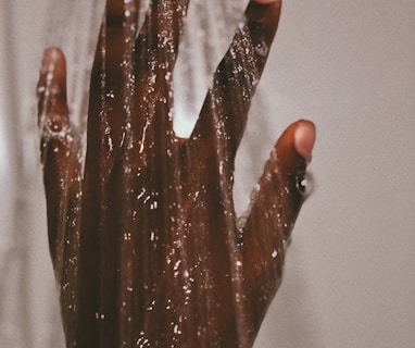 persons hand with silver ring